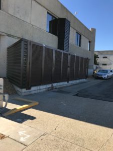 architectural mechanical screening screen louvered semi private private solid staggered board on board shadow box alternating ametco barnett and bates industrial louvers rooftop louvers beta orsogrill omega chillers generators truck wells outside storage condensors rooftop equipment patios trash dumpsters transformers HVAC courtyards pool equipment fence aluminum galvanized steel degree of openness direct visibility standalone wall louvers 