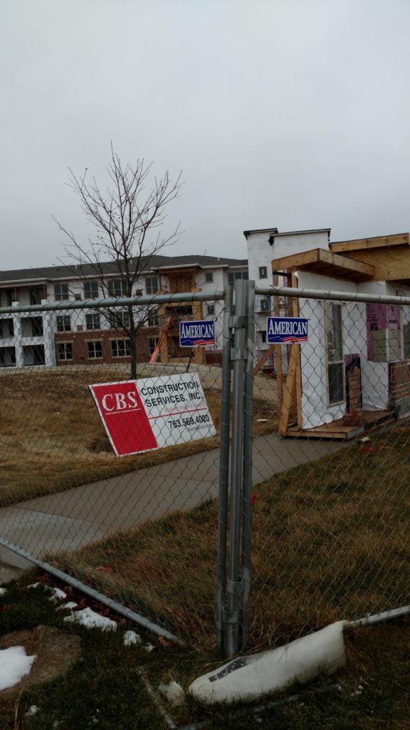 A closeup of the temporary fence surrounding Edgewater retirement home in Des Moines, IA